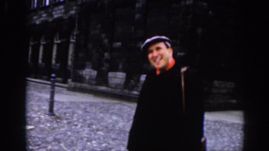 1961: Man Smiling and Talking to the Camera in Dublin, Ireland