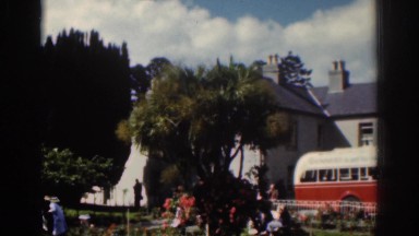 1961: people playing around in a garden area parked bus DUBLIN IRELAND