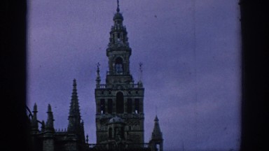 1966: View of a Castle and Tower in a European Location Surrounded by an Ornate