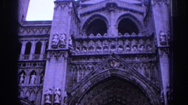 1966: Large Gothic Building with Crowd Walking Past Front Doors SPAIN