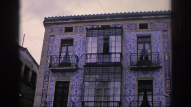 1966: A Three-Storied Building with Four Balconies and People Walking