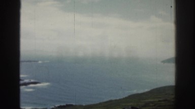 1961: view of green rocky hills and water IRELAND