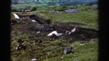 1961: desolate farm with view of mountains on a cloudy day IRELAND