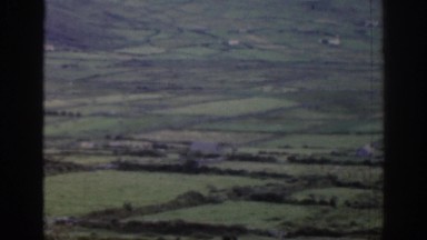 1961: open rural farmland fields and a narrow paved road IRELAND