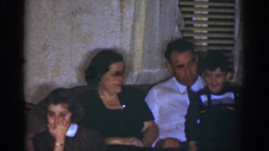 1968: Two Adults and Two Children Posing Happily in Formal Wear in Omaha