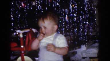 1968: little baby being pulled in a little red wagon. OMAHA NEBRASKA