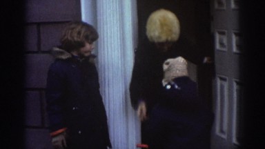 1971: woman and two kids get out of a house and wave at the camera BEDFORD