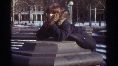 1971: a cute little boy in a winter jacket climbing up on a pillar BEDFORD