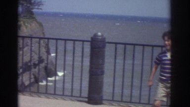 1974: Boy Being Silly at Water's Edge in Cleveland, Ohio