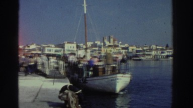 1976: People Crowding Into a Boat in the Harbor Greece