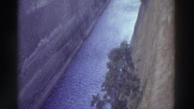 1976: A Deep, Windy Ship Channel Below a White Trestle Bridge Greece