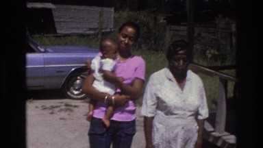 1975: family posing for a picture outside. ATLANTA GEORGIA