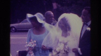 1975: people standing around with the bride waiting