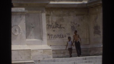 1975: young people climbing on a building. ATLANTA GEORGIA