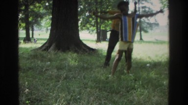 1975: two small boys dancing & enjoying on some song in garden. ATLANTA GEORGIA
