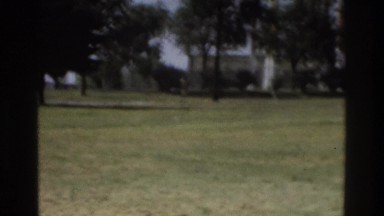 1975: man running through park by water tower ATLANTA GEORGIA