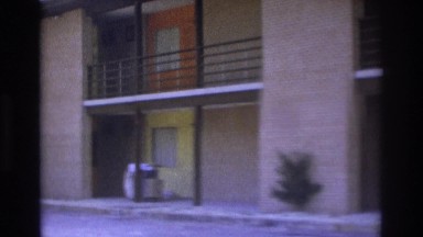 1975: two women stepping out of an apartment at daytime ATLANTA GEORGIA