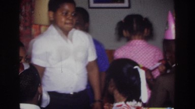 1975: birthday party of children enjoying the festivities, dancing around