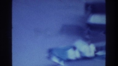 1975: Vehicles Parked at Odd Angles in Bronx Lot with Men in Suits