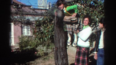 1976: Family Poses as Young Girl Dangles from Tree in Greece