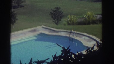 1976: Formal Swimming Pool in a Mediterranean Valley with Foliage Hills