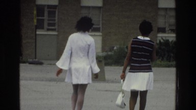 1975: two women walking in the wind BRONX NEW YORK