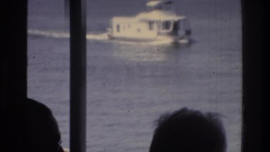 1975: tourists watching a distant ship sail across the ocean. WASHINGTON DC