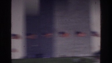 1975: arising american flags around of big and very higher building WASHINGTON