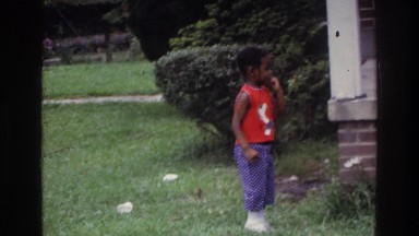 1975: mother helping little boy up the house steps. WASHINGTON DC