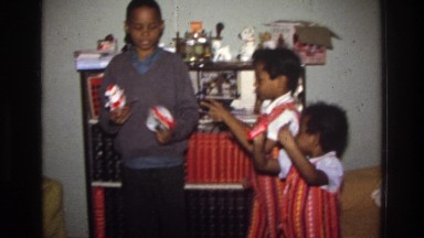 1975: children goofing off in the living room. WASHINGTON DC