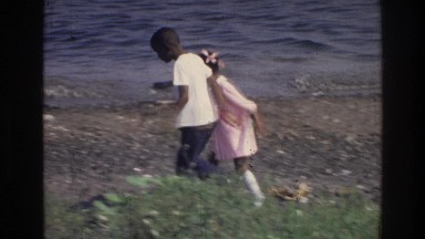 1976: kids playing on a rocky beach HARLEM NEW YORK