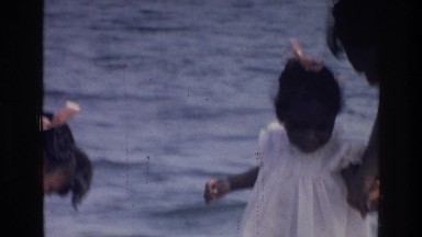 1976: two girls with mother enjoying beautiful day down by the water