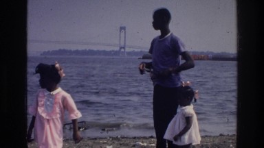 1976: three children are standing on the shore and looking at something HARLEM
