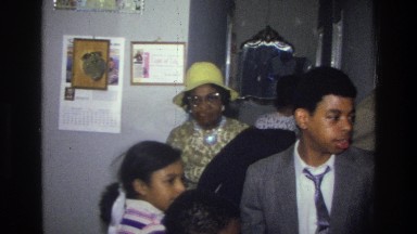 1976: family socializing together inside their home. HARLEM NEW YORK