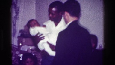 1976: family gathers around new born HARLEM NEW YORK