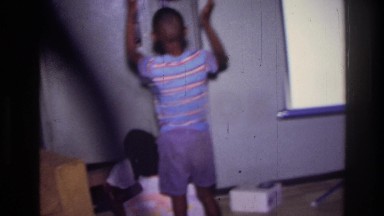 1976: cute children playing indoor with a big balloon HARLEM NEW YORK
