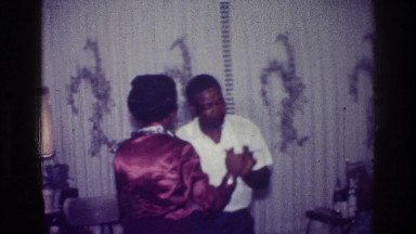 1976: man and woman dancing in the dining room HARLEM NEW YORK