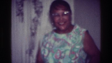 1976: family all dancing together in their living room. HARLEM NEW YORK