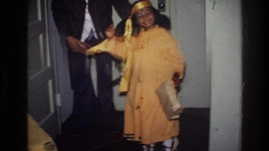 1976: a little girl in a gold halloween costume dances