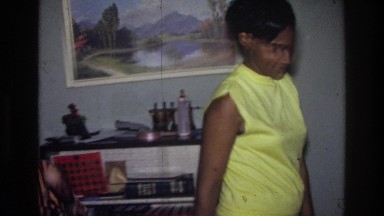 1976: a woman and her kid in the living room HARLEM NEW YORK