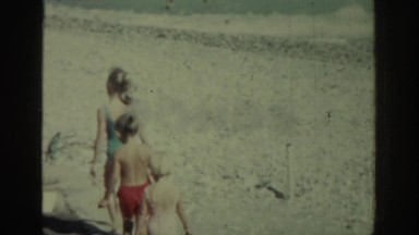 1962: Several Children Walking on a Sunny Beach in Rhodes Greece