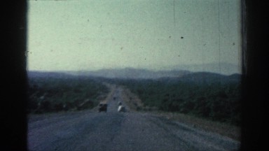 1962: Early Automobiles Travel Down Paved Freeway in Rhodes, Greece
