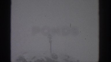 1963: Zooming in on a Warning Sign in Snowy Munich Germany
