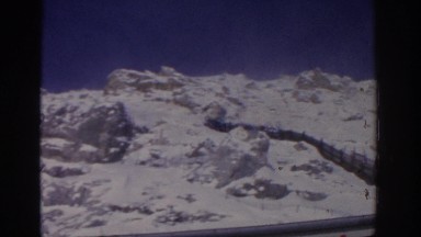 1963: a snowy mountain stands majestically under the blue clear sky MUNICH