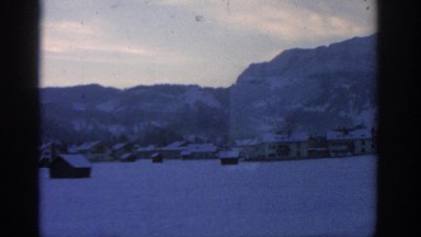 1963: drive by of a very lonely, snowy town. MUNICH GERMANY