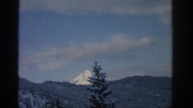 1963: a mountain in the distance, beyond a forest MUNICH GERMANY