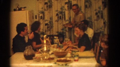 1963: Family Gathered Around Dining Table Enjoying Thanksgiving Feast