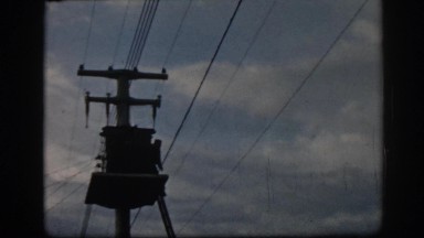 1962: Electrician Climbing Down Ladder During Power Line Repair in Ephesus Turkey