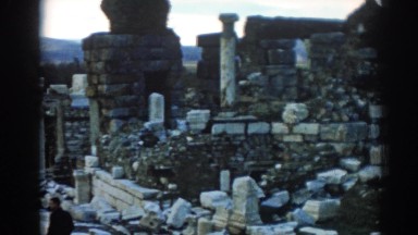 1962: stones in various colors, shapes and sizes are piled up with some bricks