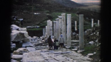 1962: two women with kids are visiting old relics of a structure EPHESUS TURKEY